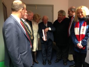 President Michael D. Higgins being presented with the book 'The Bit O'Red: A History of Sligo Rovers 1928 - 2018'
